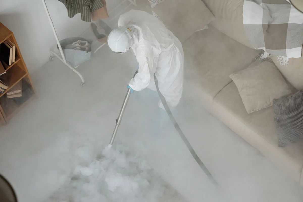 Biohazard cleanup technician in protective equipment, Inwood, WV